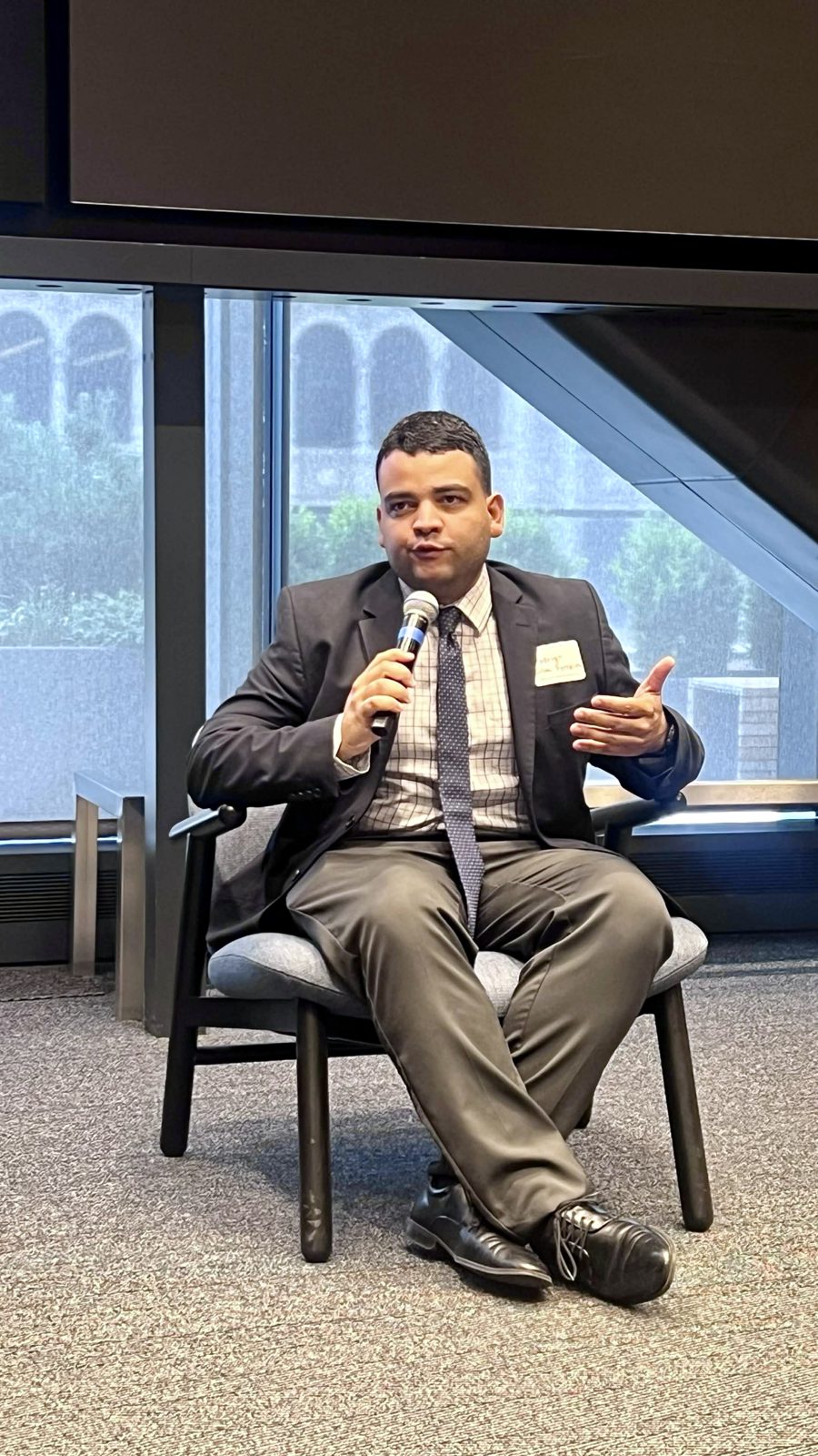 Rodrigo speaking during a panel at UN Open Source Week Community Day